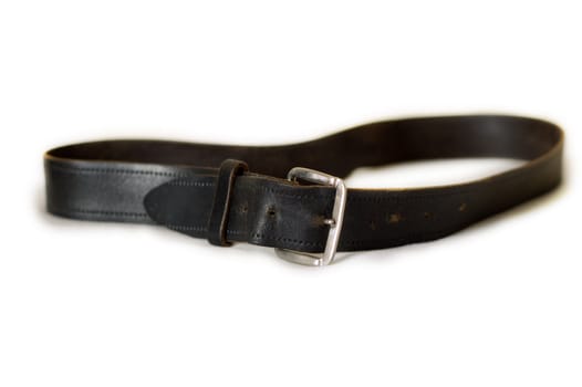 an old worn black leather belt with buckle
