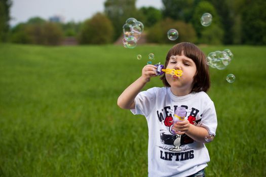 Boy and many soap-bubbles