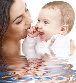 picture of happy mother with baby in water