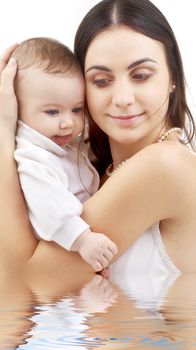 picture of happy mother with baby in water