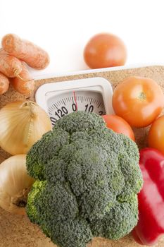 Garden vegetables on a bathroom scale