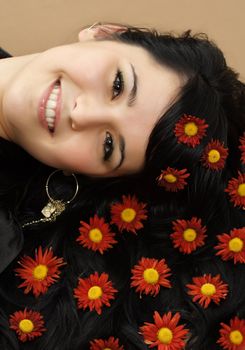 closeup portrait of nice girl with flowers on hair