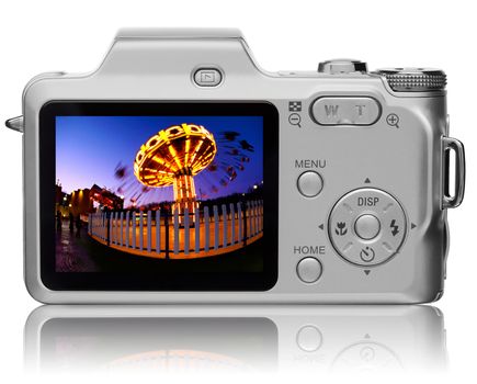 Rear view of compact digital camera with vivid picture on it's diplay