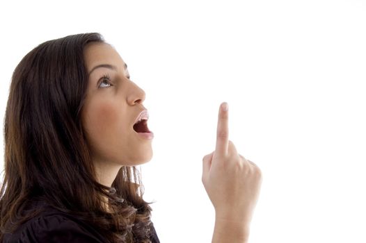 young woman pointing up with white background