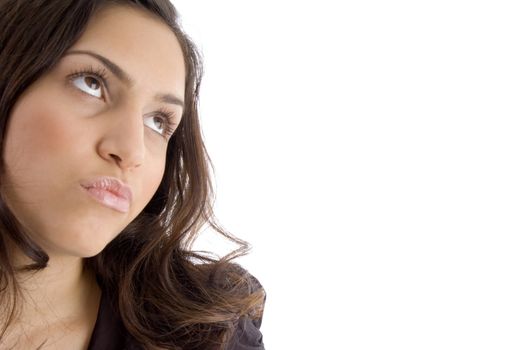 portrait of thinking young woman looking aside on an isolated background