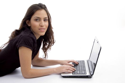 laying woman with laptop on an isolated background