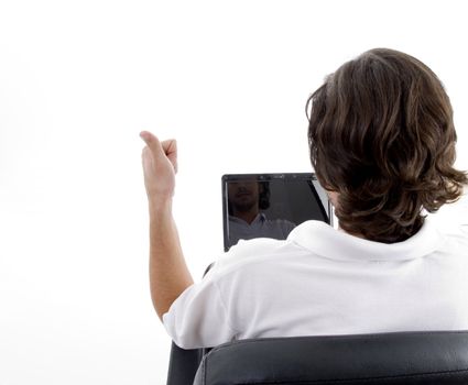 man busy with laptop and posing from back with white background