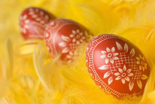 Three handmade easter eggs - selective focus on the first one.