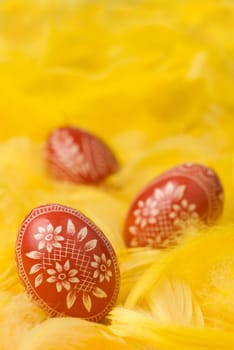 Three handmade easter eggs - selective focus on the first one.