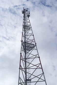 Broadcasting tower is on the background of sky.