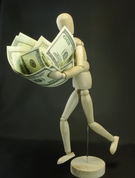 mannequin with dollars on the black background