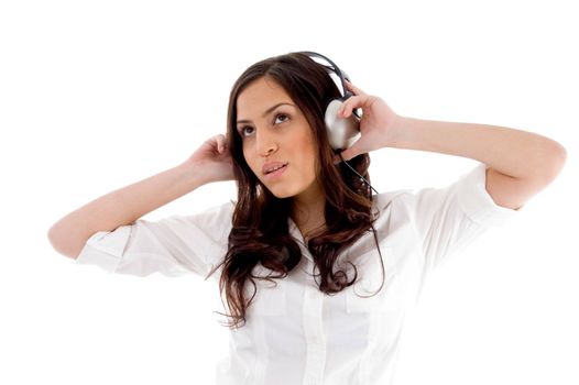 young female enjoying music with white background