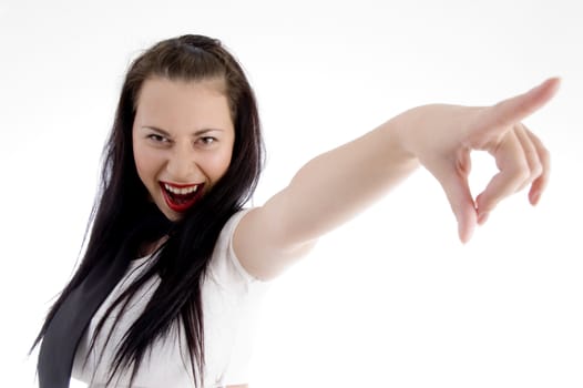 attractive woman pointing towards against white background