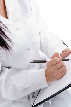 medical professional writing prescription on an isolated white background