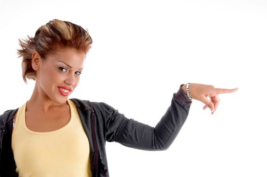 portrait of pretty female indicating side on an isolated white background