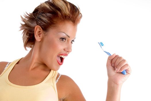 dentist posing with tooth brush against white background