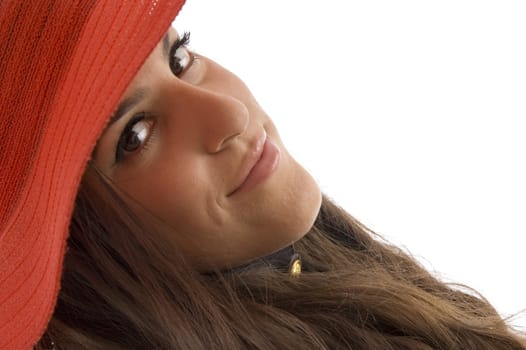 face of stylish female wearing hat on an isolated background