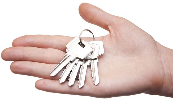 metal keys in woman hand isolated on the white background 