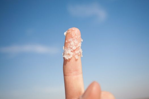 big salt crystals on the finger