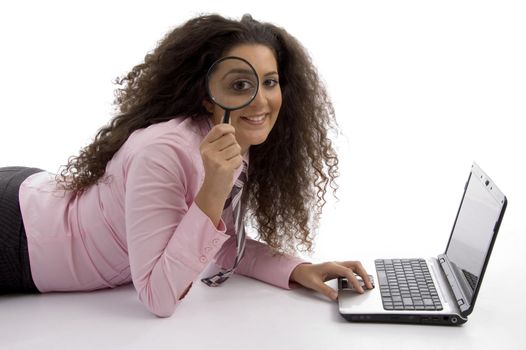 beautiful young businesswoman working on laptop against white background