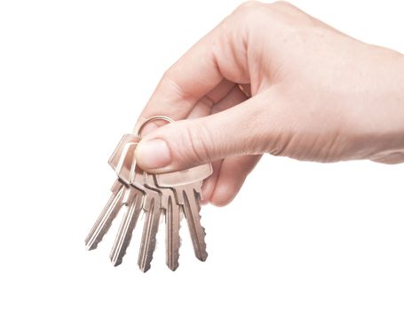 metal keys in woman hand isolated on the white background 