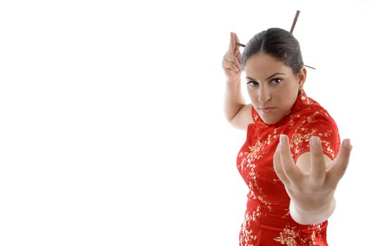 beautiful woman in fighting pose on an isolated white background