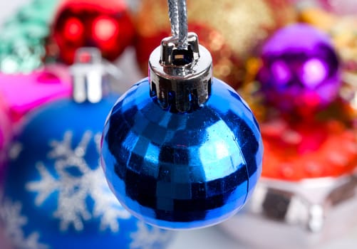 blue small fir ball, over toys background