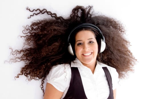 happy female enjoying music track on an isolated white background