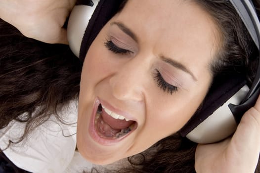 female shouting while listening music on headphone