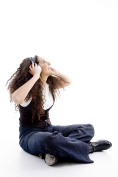 latin american female enjoying music on an isolated white background