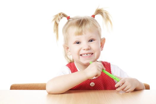 child with toothbrush in hands