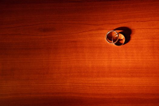 two wedding rings on the table