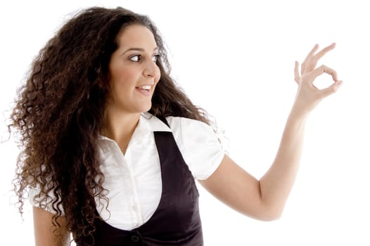 cute woman showing okay hand gesture on an isolated background