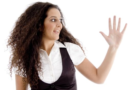 hispanic female posing with curly hairs and showing palm with white background