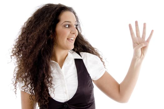 woman counting the number four against white background