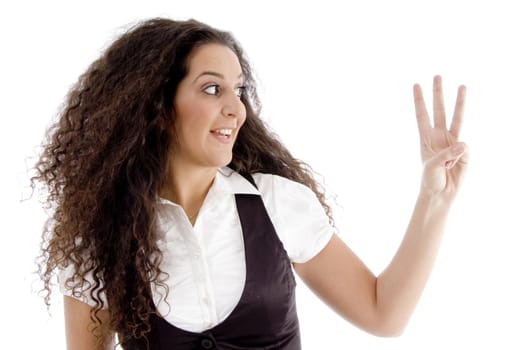 beautiful woman counting three number with fingers on an isolated white background