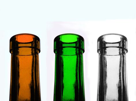 three recycable glass bottles in different colours, transparent, green, brown