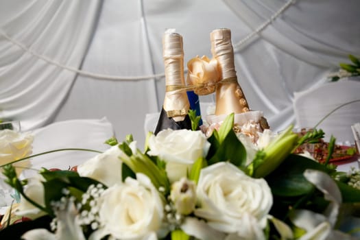 bolltes of champagne as bride and groom