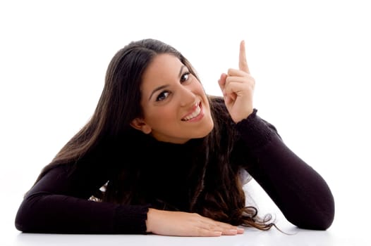 pointing female looking at camera on an isolated background