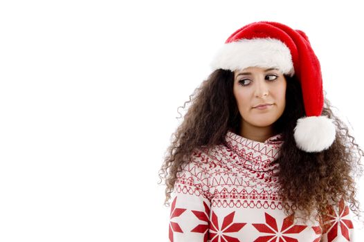 young female with christmas hat looking upward on an isolated background