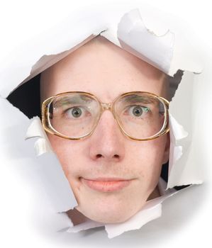 Person bespectacled put out from sheet of paper on the white background