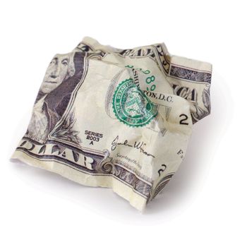crumpled dollar photographed on a white background