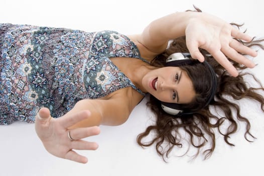 high angle view of high angle view of laying model with headphone on an isolated white background