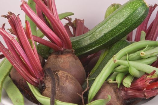 Vegetables, beetroot, courgettes,  french beans, runner beans, on white.