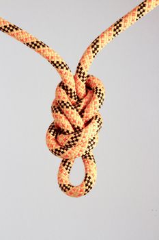 Figure of eight knot on white background.