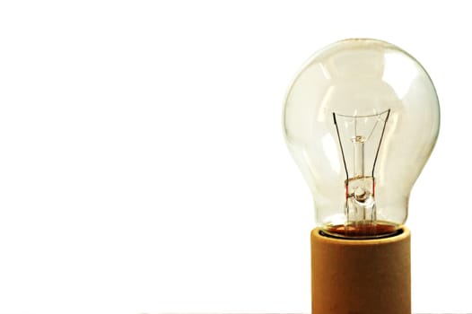 An old light bulb off, isolated on white background and on a socket