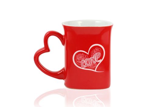 Red Mug with a heart and write love with flowers isolated