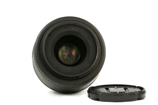 A 35mm prime dslr lens in detail isolated on white background frontal view
