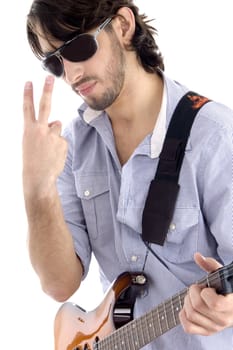 young guy holding guitar and gesturing with white background