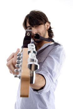 handsome man pointing at you with guitar against white background